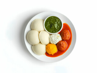 Delicious south indian thali featuring idli, sambhar, and chutney on a white plate