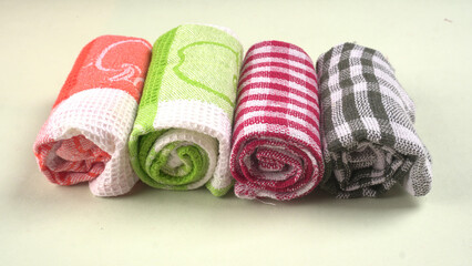Clean sponge cloths with a checkered pattern isolated on white background. Household cleaning...