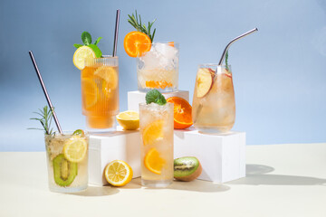 Summer cold cocktails with fruits and ice in glass glasses.
Advertising. Banner for bar