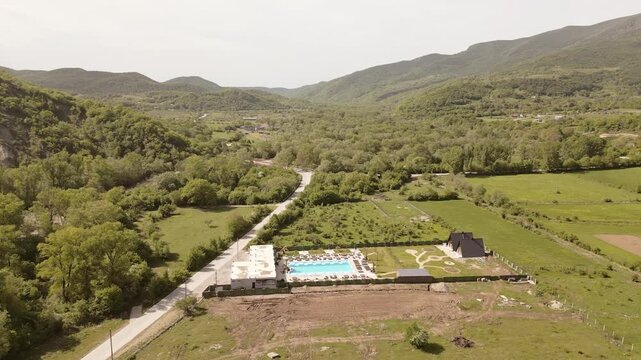 Aerial panorama highway road and Luxury Villa in Kakheti Region &ndash; Tranquil Retreat for Travel and Relaxation in the Heart of the Caucasus Mountains.Efficient Space Planning and Functional Architecture