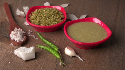Coconut chutney in a bowl with raw coconut and green chilli ,Served with dosa, idli, vada
