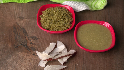 Coconut chutney in a bowl with raw coconut and green chilli ,Served with dosa, idli, vada

