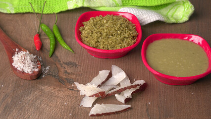 Coconut chutney in a bowl with raw coconut and green chilli ,Served with dosa, idli, vada
