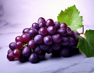 Fototapeta premium a fresh cluster of dark purple grapes with green leaves perfect for healthy snacking or use in recipes and drinks