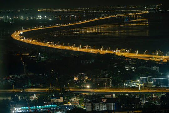 A stunning view of Atal Setu at night and rapid urban development. The image captures the essence of a growing metropolitan city with impressive architecture.