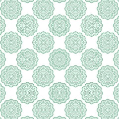 Arabian ethnic tribal fabric showcases a delicate floral pattern in a soft light green tone, beautifully ethnic contrasting with a clean white background. The design brings an ethnic sense of classic 