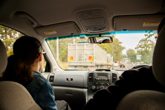Teen girl navigating on road trip
