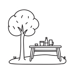 Naklejka premium A table placed under a tree in a backyard picnic