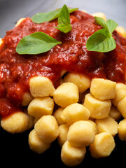 Gnocchi di patata, italian potato noodle with tomato sauce and basil