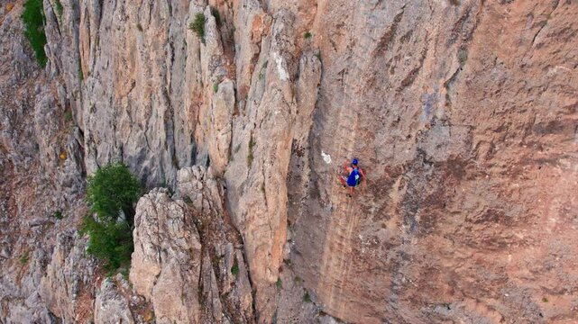 &ldquo;Extreme Via Ferrata Adventure &ndash; Climbers Hanging on Vertical Rock Wall&rdquo;