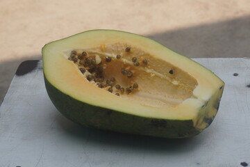 Papaya is a tropical fruit with sweet, orange flesh, rich in vitamins, enzymes, and antioxidants, promoting digestion and health.
