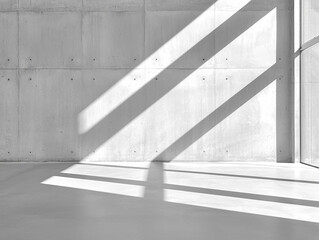 Fototapeta premium An empty concrete room with sunlight streaming in, casting bold shadows on the walls, creating a peaceful and modern minimalist background.