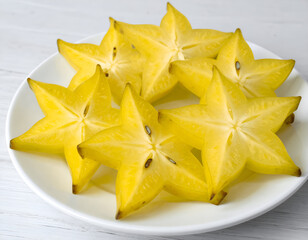 Fototapeta premium Sliced Starfruit on a Round Plate