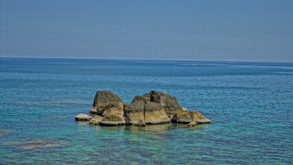 The stone that was created as a small island in the blue sea.   © Somchai