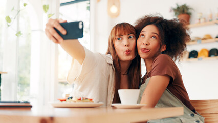 Selfie, tongue out and women in coffee shop, silly and photography for memory of reunion or embrace. Goofy, friends and bonding on break with profile picture, happy or social media on weekend in cafe