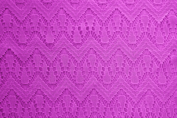 pink fabric with geometric lace pattern. abstract geometric background