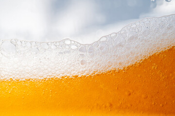 Close up bright orange Oil or beer splash texture and nature waves, Beautiful waves curve and little bubbles smooth for graphic design and background, Oil Bubbles, Soft beer bubbles, Selective focus