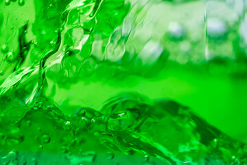 Water wave, close up of vibrant green liquid with bubbles, capturing dynamic movement and...
