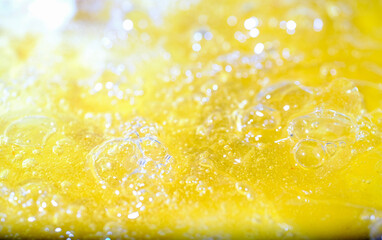 Close up bright orange Oil or beer splash texture and nature waves, Beautiful waves curve and...