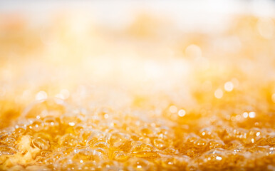 Close up bright orange Oil or beer splash texture and nature waves, Beautiful waves curve and...