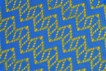 blue fabric with geometric lace pattern. abstract geometric background