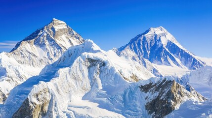 Fototapeta premium Majestic Snow-Capped Peaks Against Clear Blue Sky