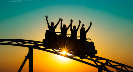 Obraz premium Excited People Riding a Roller Coaster with Arms Raised at Sunset Silhouette with Turquoise Sky and Orange Sunlight