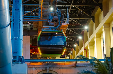 the cabin leaves the cable car parking lot, climbing up the cables. The technical elements are...
