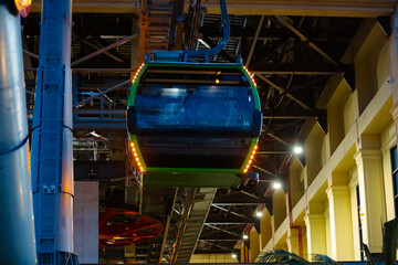 the cabin leaves the cable car parking lot, climbing up the cables. The technical elements are...