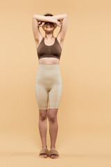 Embracing beauty and confidence through body positivity in a warm toned setting