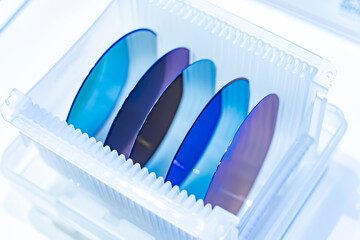 patterned silicon wafers in a universal pod. Electronic circuit designs have been built onto the wafers using micromaching including photolithography