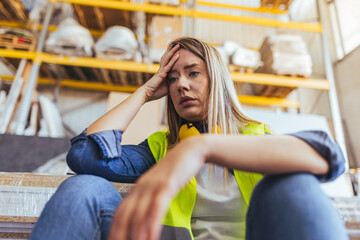 Stressed Warehouse Worker Experiencing Burnout in a Stockroom Setting