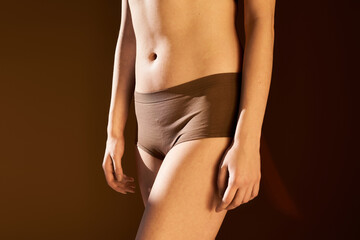 Celebrating body positivity through confident self expression in warm lighting