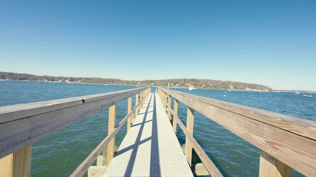 Drone footage of Bird Island between Northport Bay and Centerport Harbor, showing coastal homes, marinas, and the shoreline of Long Island&rsquo;s North Shore on a peaceful sunny day.