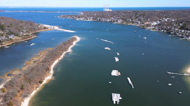 Drone footage of Bird Island between Northport Bay and Centerport Harbor, showing coastal homes, marinas, and the shoreline of Long Island&rsquo;s North Shore on a peaceful sunny day.