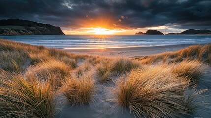 A serene beach scene at sunset, featuring gentle waves lapping against the shore.