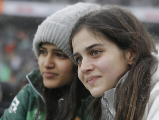 emotional photograph of indian cricket fans celebrating a historic victory, waving national flags and cheering with tears of joy in their eyes,