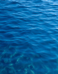 The serene, glassy surface of the Mediterranean Sea at dawn, isometry. with white shades