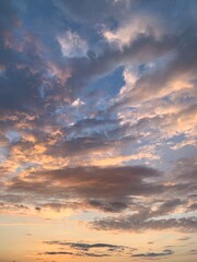 Beautiful sunset. Evening. Golden Hour. Orange clouds against the blue sky.