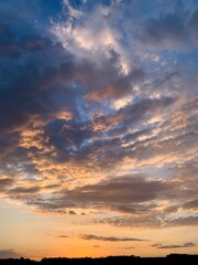 Obraz premium Beautiful sunset. Evening. Golden Hour. Orange clouds against the blue sky.