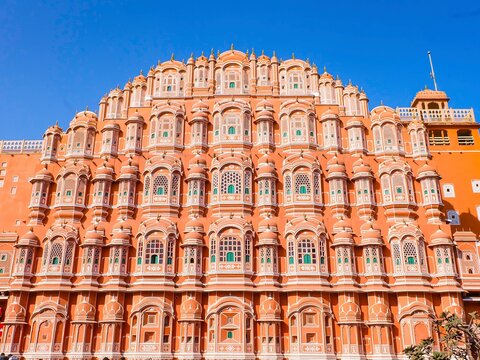 Hawa Mahal or the wind palace, The Pink City and the City Palace of Jaipur, India on a sunny beautiful clear blue sky