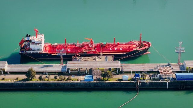 Ship carrying the LPG in the sea port for loading operations, Aerial view. Energy export and import business for transportation