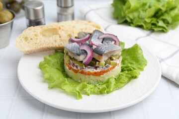 Delicious salad with herring, vegetables and bread on white table, closeup