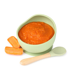 Baby food. Tasty puree in bowl, carrot and spoon isolated on white
