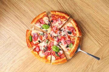 Tasty pizza with thin smoked sausages on wooden table, top view