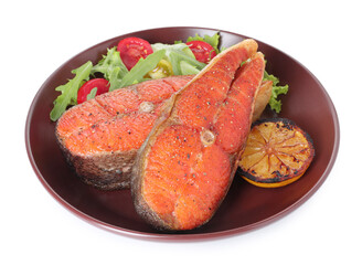 Seafood. Tasty salmon steaks, salad and lemon isolated on white