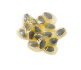 Passion fruit seeds isolated on white, top view