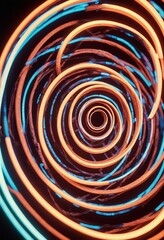 Abstract spirals in neon glow with high energy.