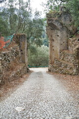 Entrance gate to the ruins of the old village of Oppido in Aspromonte, Calabria, Italy