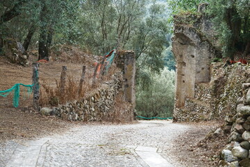 Entrance gate to the ruins of the old village of Oppido in Aspromonte, Calabria, Italy